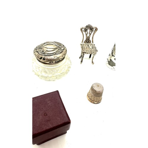 432 - Selection of silver items includes tea strainer, trinket pot etc