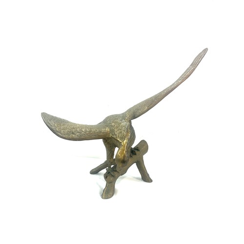 268 - Large brass hollow eagle figure, measures approximately 20 inches tall 26 inches wide