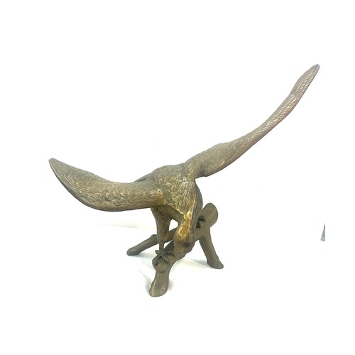 268 - Large brass hollow eagle figure, measures approximately 20 inches tall 26 inches wide