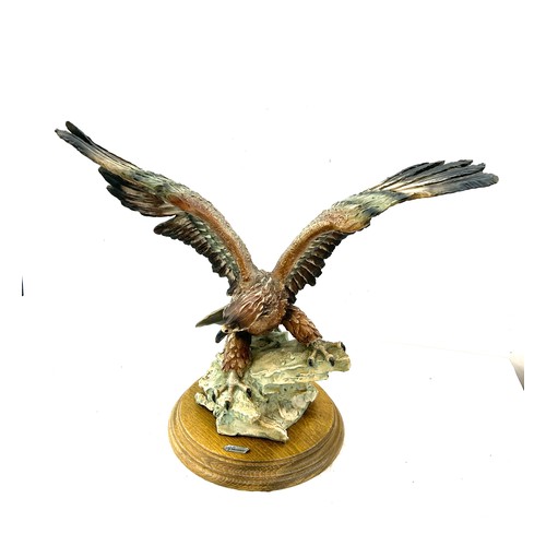 105 - Giuseppe Armani Capodimonte golden eagle figurine measures approximately 12 inches by 15 inches