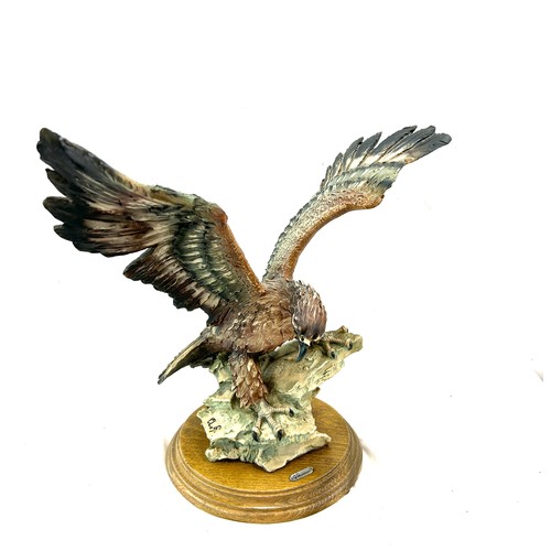 105 - Giuseppe Armani Capodimonte golden eagle figurine measures approximately 12 inches by 15 inches