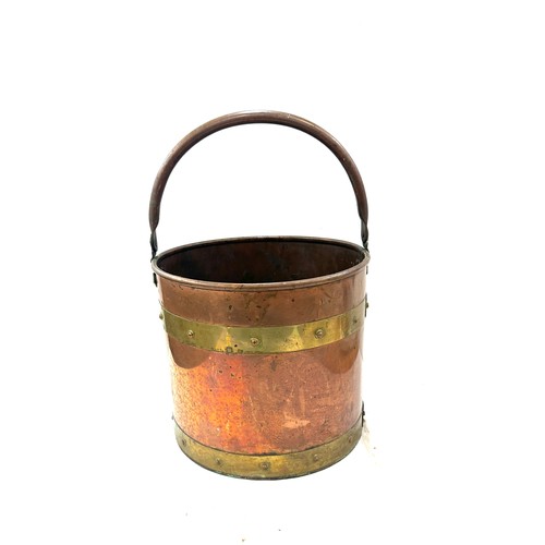 245 - Vintage brass and copper bucket, measures approximately 17 inches tall 12 inches diameter