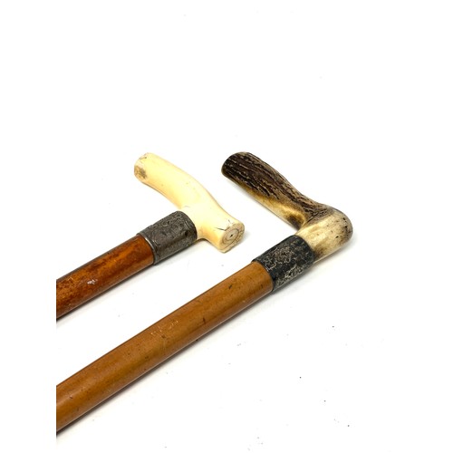 414 - 2 Antique silver collar walking sticks bone handles