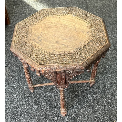 306 - Walsh and co heavily carved Indian table measures approx 21 inches tall by 20 diameter