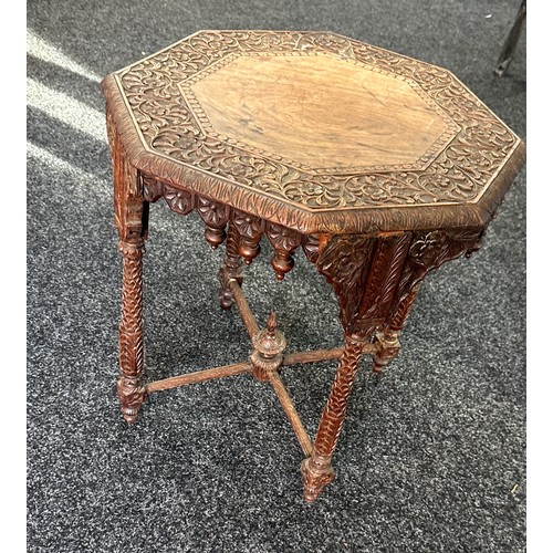 306 - Walsh and co heavily carved Indian table measures approx 21 inches tall by 20 diameter