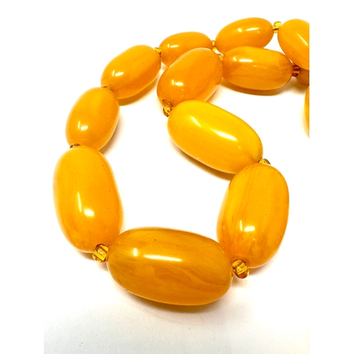 409 - Vintage amber type bead necklace weight 70g