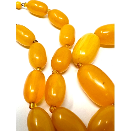 409 - Vintage amber type bead necklace weight 70g