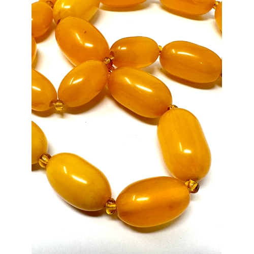 409 - Vintage amber type bead necklace weight 70g