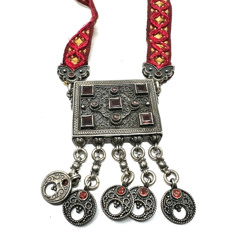 261 - Silver 925 Afghan Kuchi tribal necklace; a large silver rectangular centerpiece set with red glass s... 