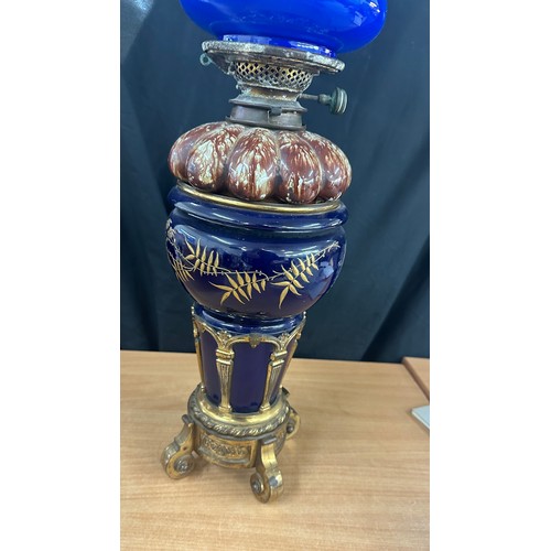 249 - Royal Doulton oil lamp with gilded bronze mounts with glass shade and chimney height approximately 7... 