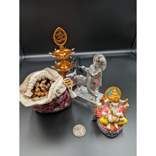 24 - Sindu Gods/Goddesses: Ganesha idol, Krishna playing the flute made of metal, bag of prayer beads, co... 