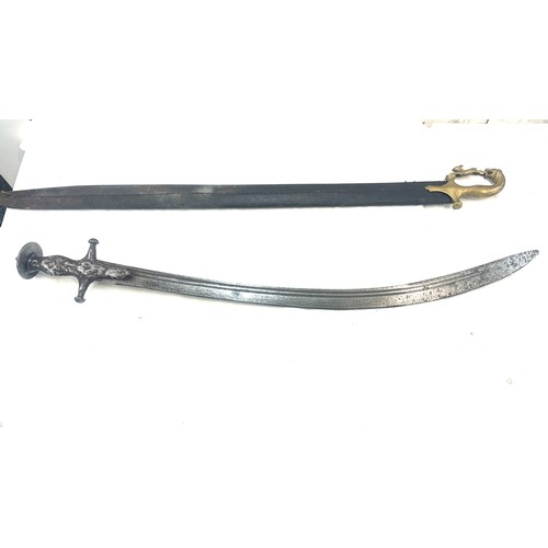 270 - One lot of Indo Persian antiques 
Indo-Persian steel Tulwar with scabbard.
Vintage serrated snake bl... 