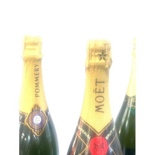 560 - Bottle of Moet and chandon champagne and a bottle of Pommery and a bottle of dry Ava