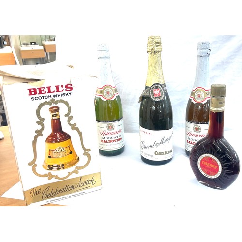 566 - Selection of alcohol includes Cherry brandy, Baldovino, boxed bells whiskey etc