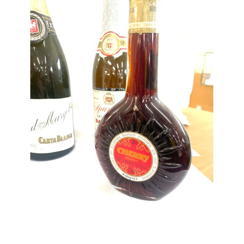 566 - Selection of alcohol includes Cherry brandy, Baldovino, boxed bells whiskey etc