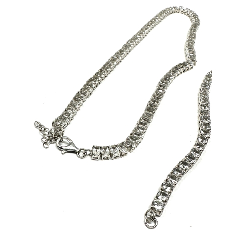 315 - A silver stone set tennis necklace and bracelet by TGGC (54g)