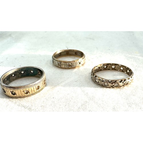 577 - Three 9ct and silver vintage eternity rings