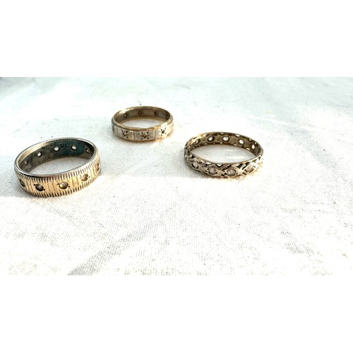 577 - Three 9ct and silver vintage eternity rings