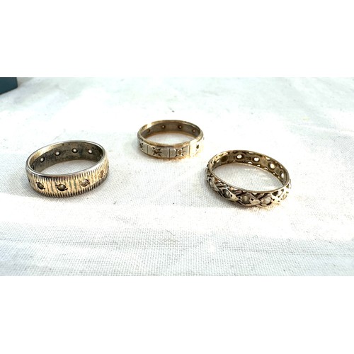 577 - Three 9ct and silver vintage eternity rings