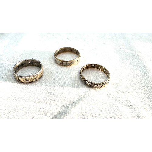 577 - Three 9ct and silver vintage eternity rings