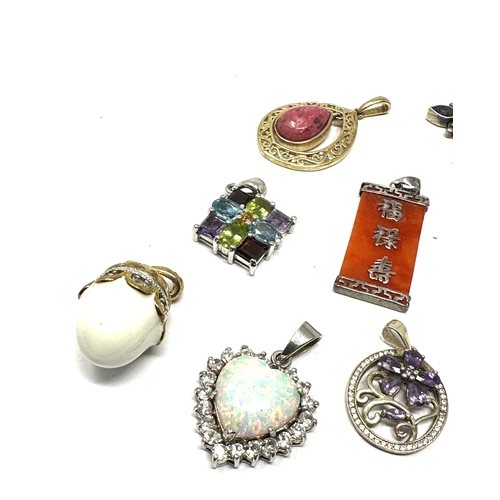 290 - Ten silver stone set pendants including opal and emerald (50g)