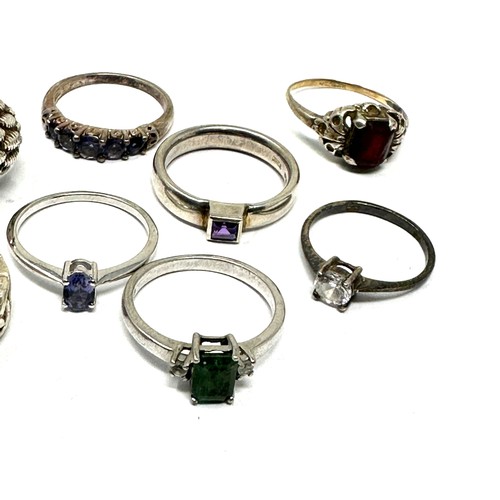 286 - Eight silver stone set rings including emerald and amethyst  (27g)