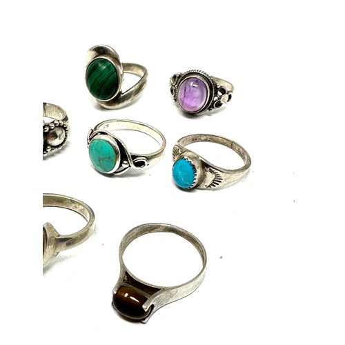 288 - Eight silver stone set rings including turquoise and malachite (34g)