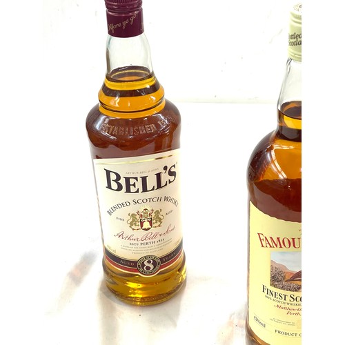 565 - Bottle of Bells, Teachers and Famous Grouse whiskey