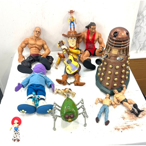 157 - Selection of toys includes WWE, Toy story, tweenies, dr who etc