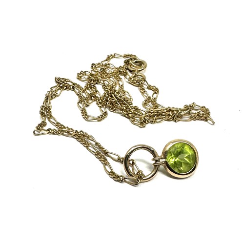 127 - 9ct gold peridot pendant & chain (2.2g)