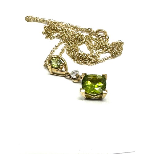 138 - 9ct gold peridot pendant & chain (2.1g)