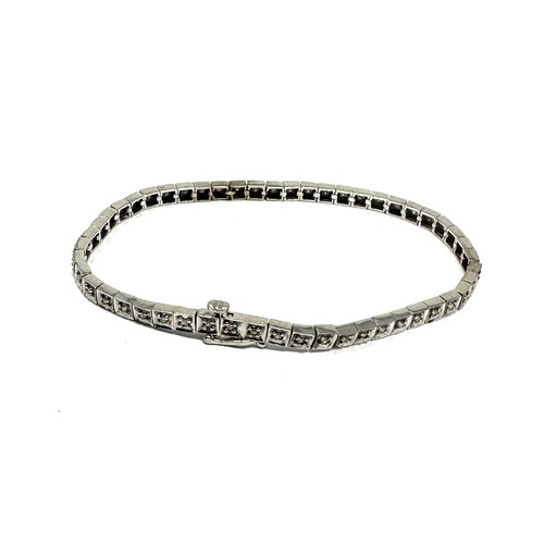 130 - 9ct gold diamond row bracelet (7.9g)