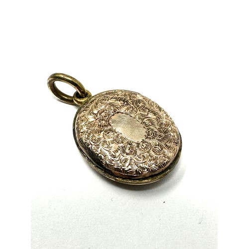 168 - 9ct gold back & front antique patterned locket (3.6g) the locket is sealed