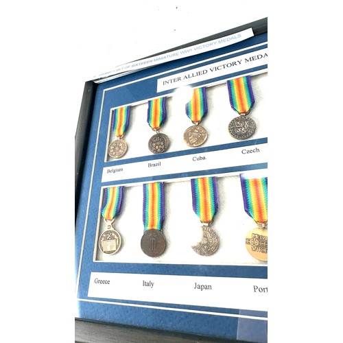 488 - Framed set of sixteen miniature WW1 Victory medals