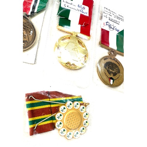 494 - Four medals for the Gulf war- Saudi Combat medal, Bahrain medal for liberation of Kuwait, Kuwait lib... 