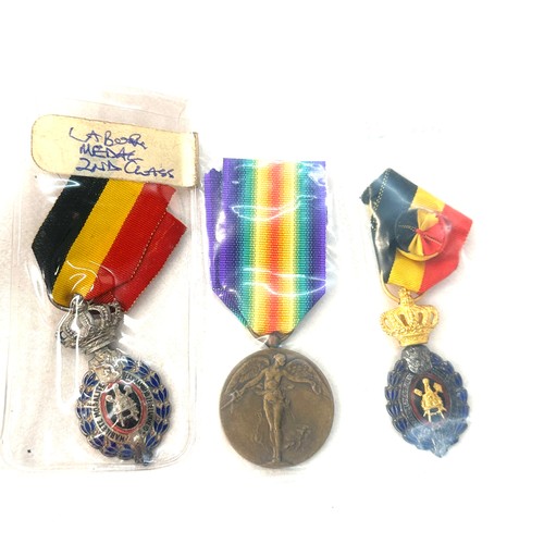 498 - A lot of three Belgium medals to include Victory medal WW1, Labour medal 1st and 2nd class