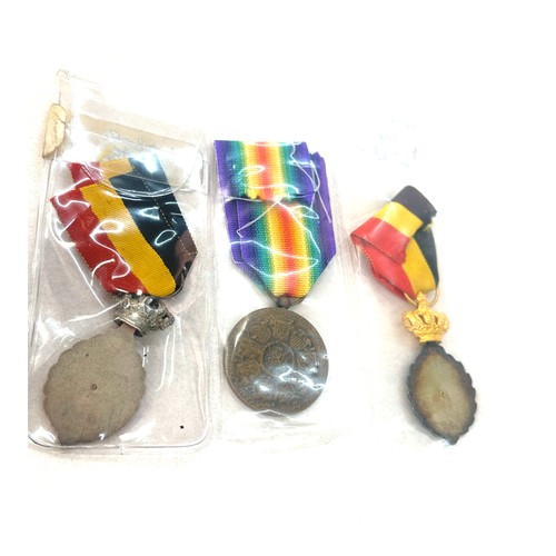 498 - A lot of three Belgium medals to include Victory medal WW1, Labour medal 1st and 2nd class