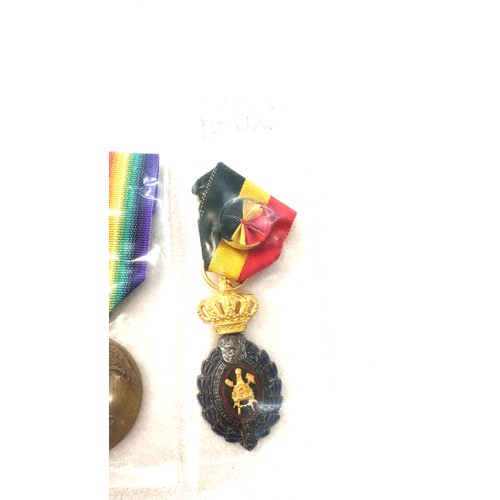 498 - A lot of three Belgium medals to include Victory medal WW1, Labour medal 1st and 2nd class