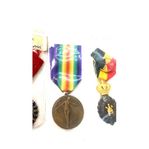 498 - A lot of three Belgium medals to include Victory medal WW1, Labour medal 1st and 2nd class