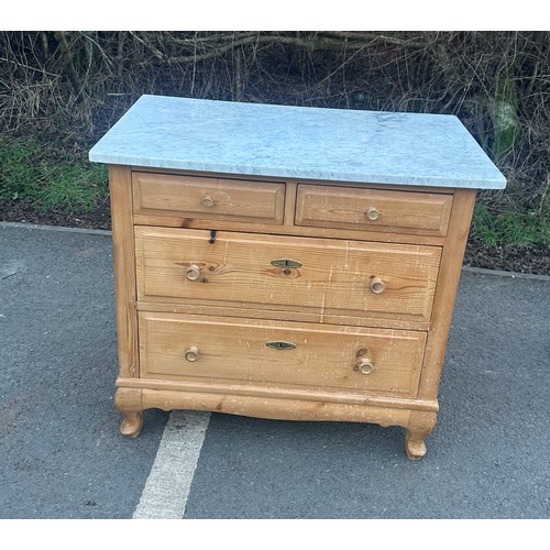 343 - 2 over 2 french stripped pine marble chest of drawers measures approximately 30 inches wide 33 inche... 