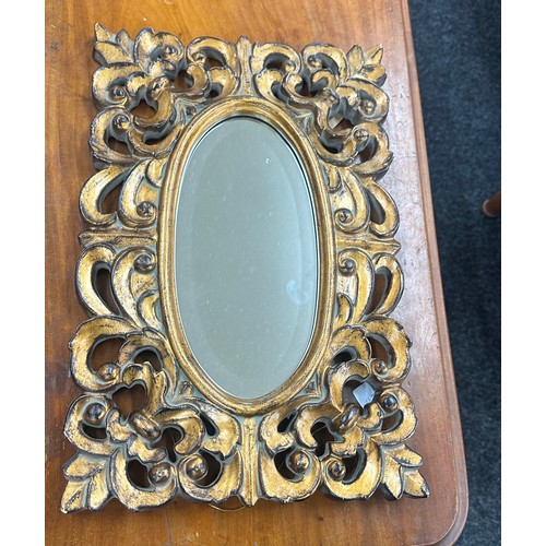 78 - Gilded oval bevelled mirror measures approx 18 x 12 inches