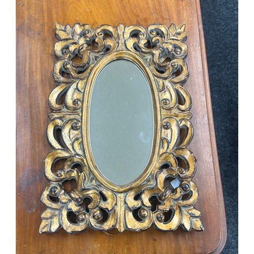 78 - Gilded oval bevelled mirror measures approx 18 x 12 inches