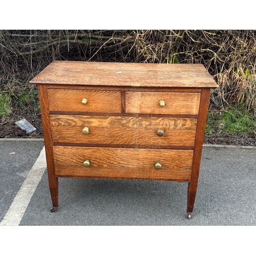 316 - 2 Over 2 antique oak chest of drawers measures approximately 32 inches tall 36 inches wide 18 inches... 