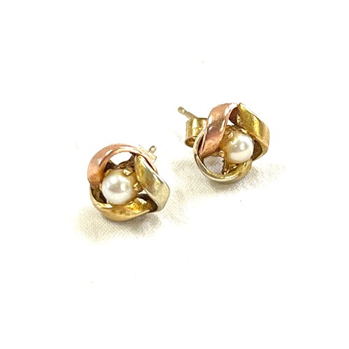 387 - Pair 9ct gold two tone ladies pearl set earrings, knot design.