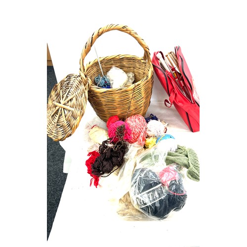 295 - Lidded wicker basket with a selection of assorted knitting equipment