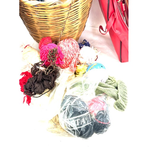 295 - Lidded wicker basket with a selection of assorted knitting equipment