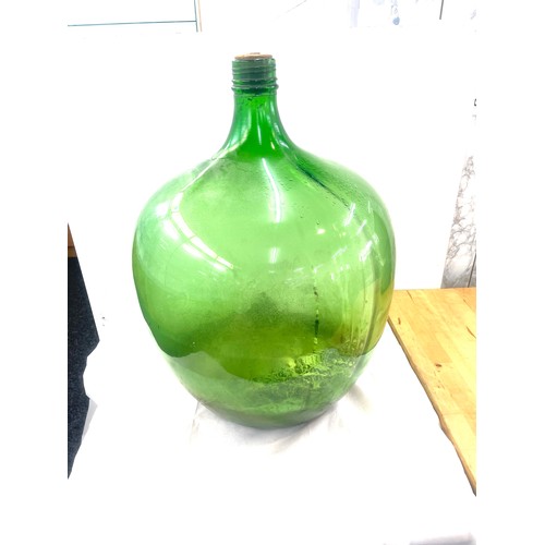 398 - Large green glass car boy measures approximately 27 inches tall 16 inches wide