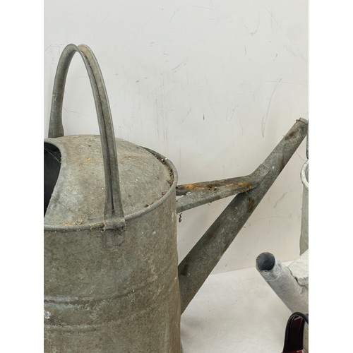 163 - 2 Galvanised watering cans and a barge ware watering can height of the tallest 16 inches