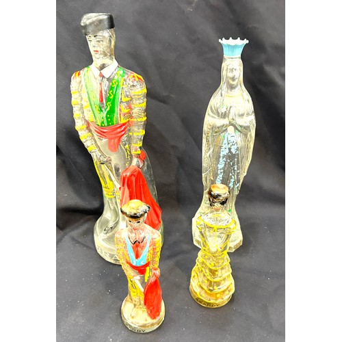 446 - Selection of spanish novelty decanters tallest measures 12 inches