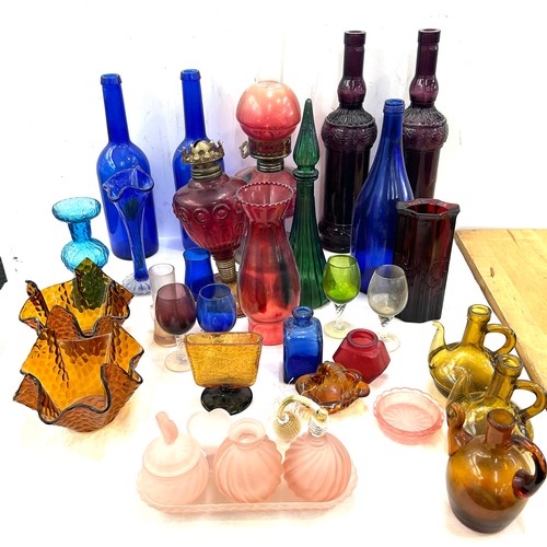 239 - Large selection of coloured glass includes decanters etc